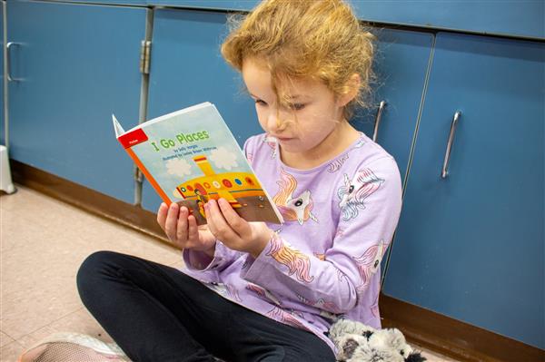 student reading book 